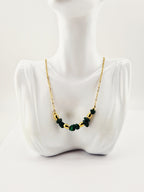 Voici la **balise alt optimisée SEO** pour ton image 👇

**Alt :**

Collier agatha doré en acier inoxydable avec perles naturelles vertes et dorées, bijou élégant et raffiné`
