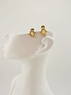 Boucles d’oreilles dorées Roxana en acier inoxydable avec pierre claire et détails perlés